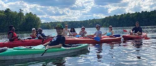 Kritzer Lab members kayaking on a river
