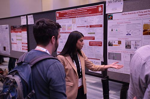 Dipna Patel discussing a research poster