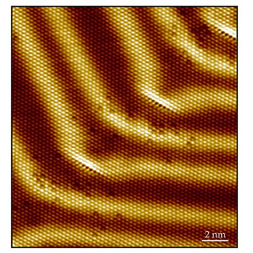 Atomically resolved scanning tunneling microscopy image of Palladium/Gold{111} at 7 Kelvin