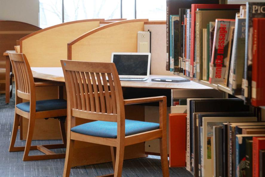 Books and desks at a study area in Tisch Library