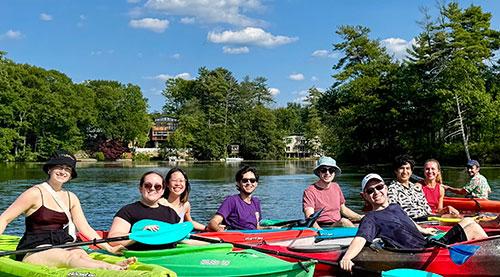 The Kritzer lab members are kayaking on a lake